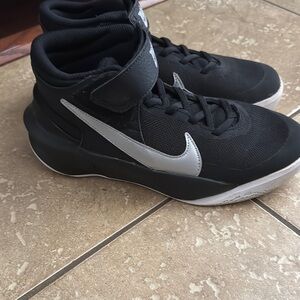 Nike Black and Silver Athletic Shoes with Mid-Top Design